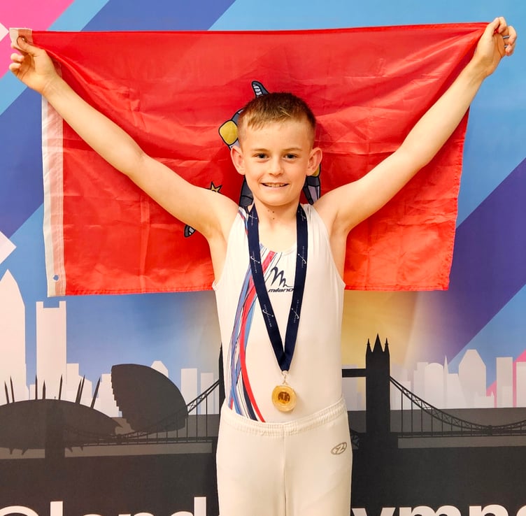 Ryan Hampton flies the Manx flag with his gold medal which he won at the Men’s London Open gymnastics competition in Ilford last weekend