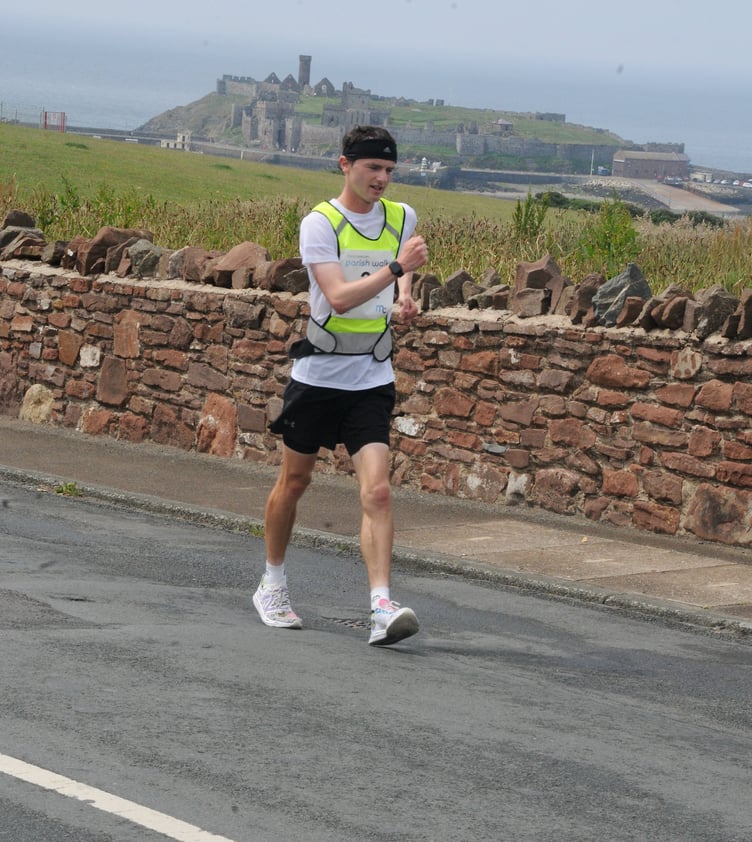 Callum Gawne heads through Peel on his way to claiming his first Manx Telecom Parish Walk victory (Photo: John Watterson)