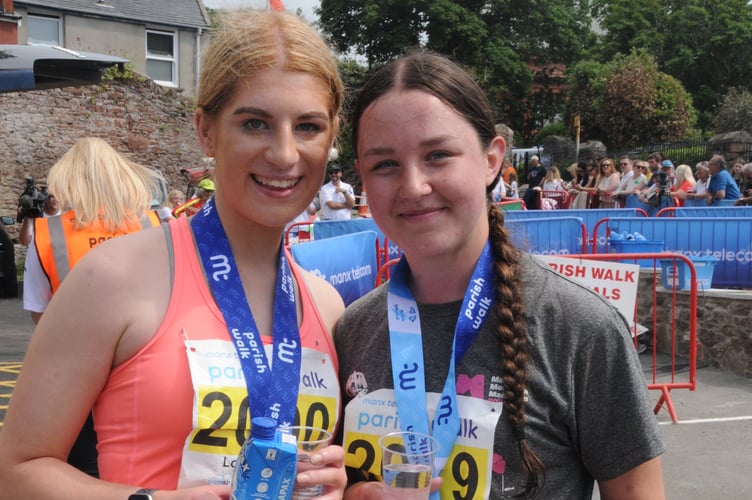 Close friends Lottie Stennett (left) and Madison McMullan crossed the line together in third place to take the women's honours in the Under-21 Parish Walk (Photo: John Watterson)