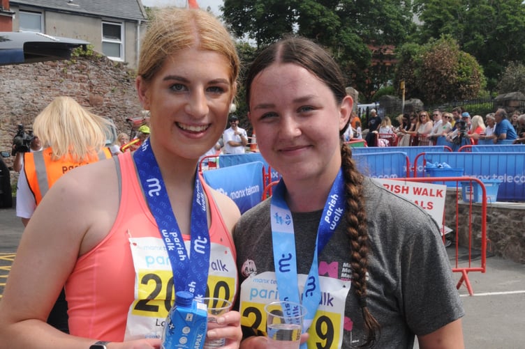 Close friends Lottie Stennett (left) and Madison McMullan crossed the line together in third place to take the women's honours in the Under-21 Parish Walk (Photo: John Watterson)