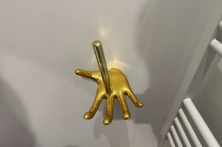 The hand out the wall toilet roll holder that initially gave Tom a bit of a fright