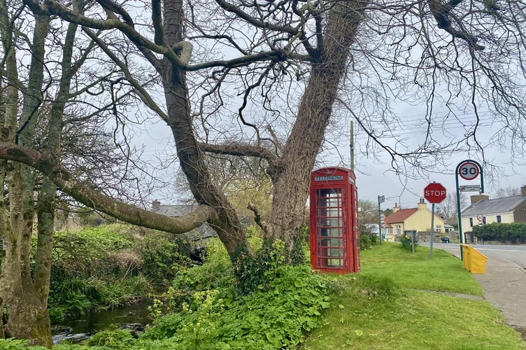 The decommissioned red telephone kiosk at Colby Bridge