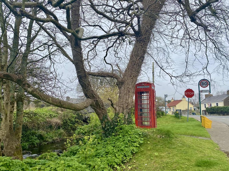 The decommissioned red telephone kiosk at Colby Bridge