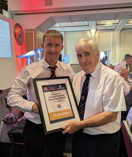 FC Isle of Man vice-chairman Lee Dixon (left) receiving the fair play award from the NWCFL's Jeff Voller