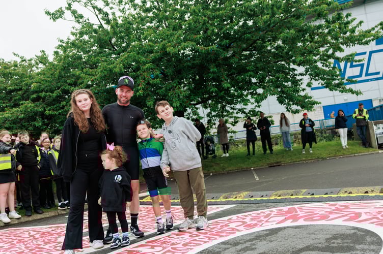 Sir Mark and his children on what was undoubtedly an emotional day