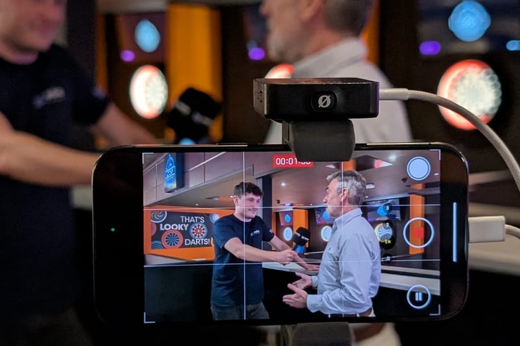 Media Isle of Man's Tom Curphey chats to Brett Martin in the new Looky's Darts area of the Palace Hotel