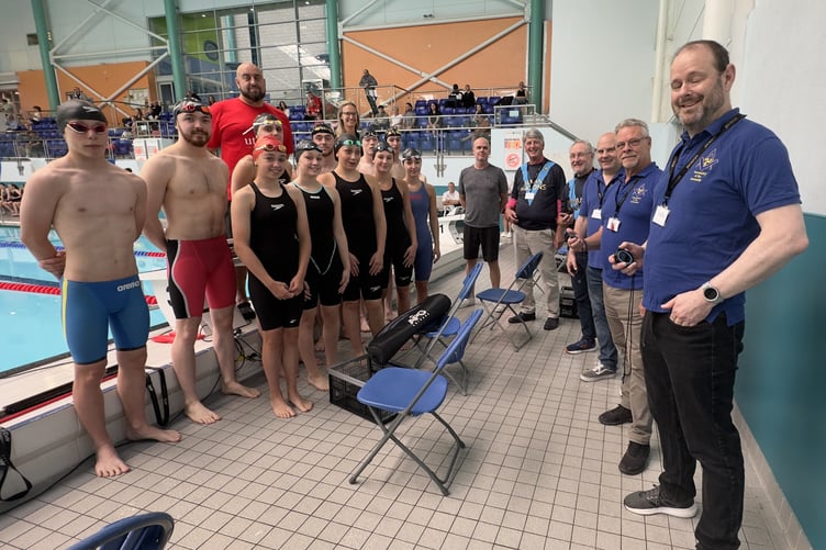 Freemasons Dave Wilson (closest), Colin Lias, Ieuan Morris, Theo Fleurbaay and Tim Earl with the Island Games-bound swimming squad and coach Lee Holland and team manager Erica Bellhouse