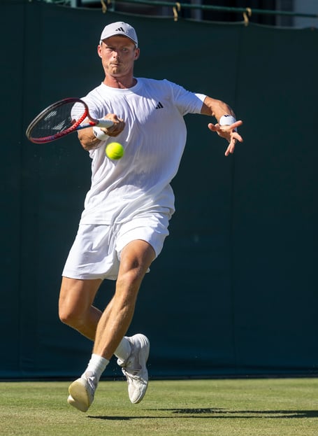 Billy Harris (GBR) plays a forehand against Dusan Lajovic (SRB) in the first round match of the Gentlemen's Singles on Court 15 at The Championships 2025. Held at The All England Lawn Tennis Club, Wimbledon. Day 1 Monday 30/06/2025. Credit: AELTC/Peter Nicholls.