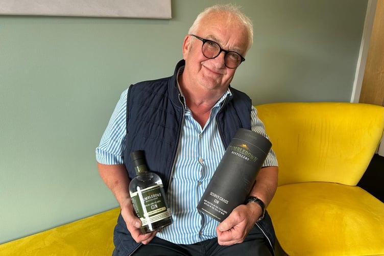 John Hellowell holding the rare Gin.