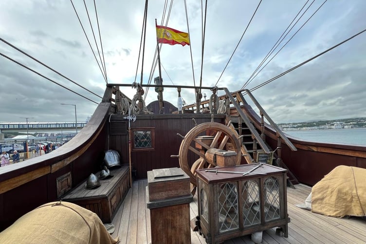 The Spanish flag is raised high on the upper deck