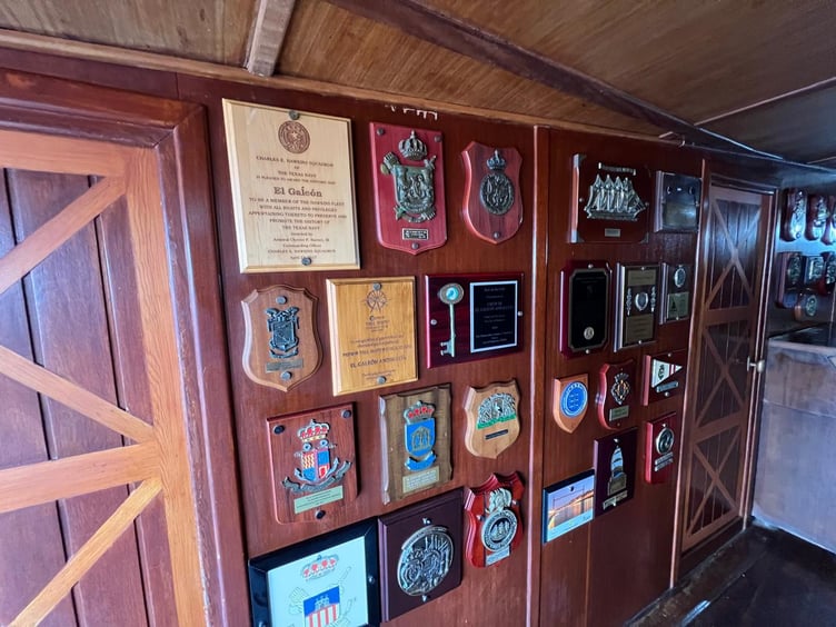 Badges displayed on the wall in the middle deck