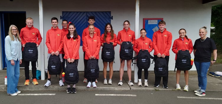 The Isle of Man athletics team for the Island Games pictured with their Dandara-branded backpacks ahead of their trip to Orkney. (Left to right) Dandara representative Joanne Christian, Corrin Leeming, Jordan Cain, assistant manager Steve Partington, Jessica Schreuder, Matt Davis, team manager Petra Atchison, Lucy Ormsby, Aimee Christian, Carla Teece, Ben Sinclair, Hope Lewis and Dandara's Jacky Ewing