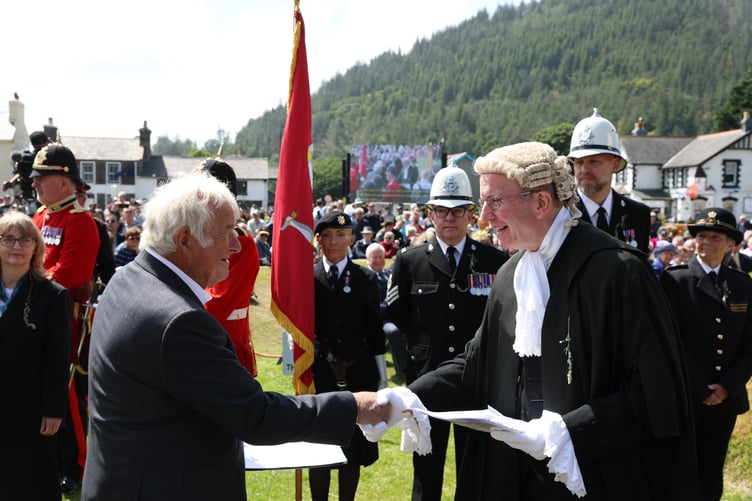 Petitioner Trevor Cowin hands in his petition for redress