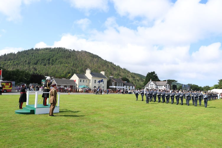 Lieutenant Governor Sir John Lorimer giving a general salute on the saluting dais
