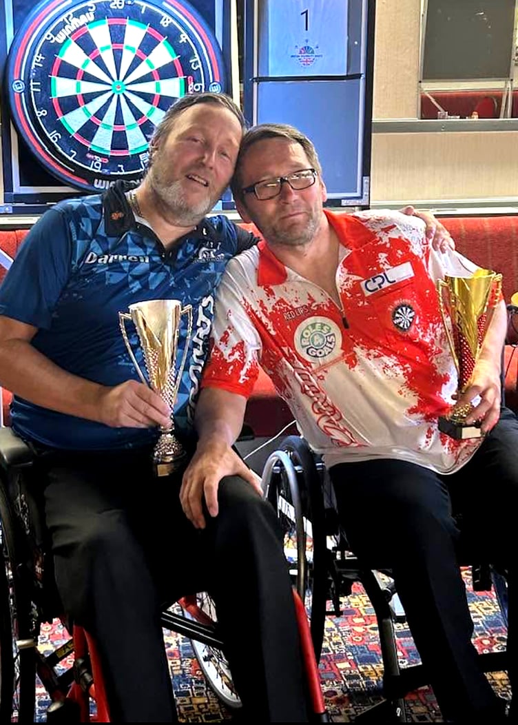 An exhausted Darren Kennish (left) pictured alongside Mark Could at one of his recent competitions