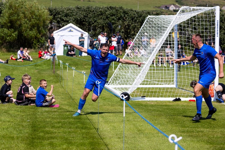 Isle of Man captain Frank Jones wheels away in celebration after opening the scoring for the Manx side inside the opening minute during the Men's first match at this week's Island Games in Orkney. The IoM team comprehensively defeated Hitra 7-2 to get their campaign off to a great start (Photo: Gary Weightman)