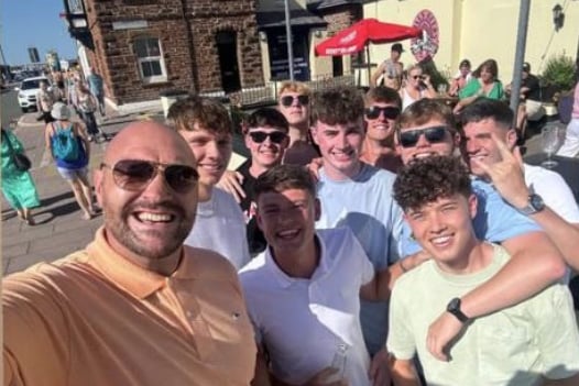Tyson Fury with customers outside the Peveril Hotel in Peel