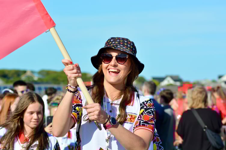 The Manx contingent of 179 being led by flag bearer Laura Kinley
