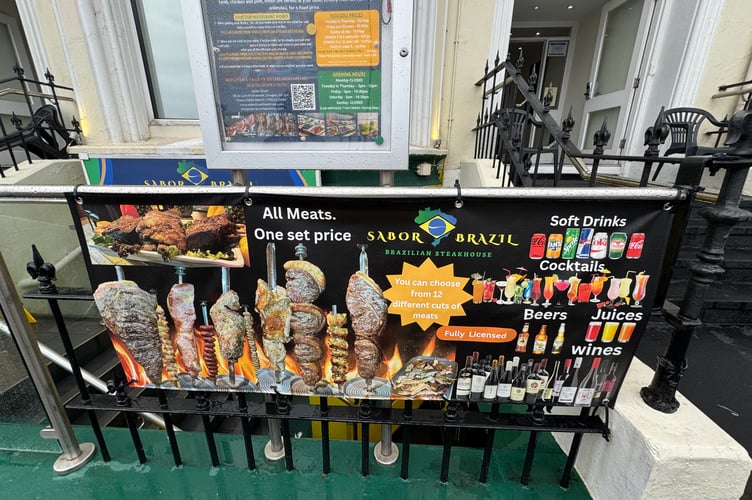 The sign outside does lure you in