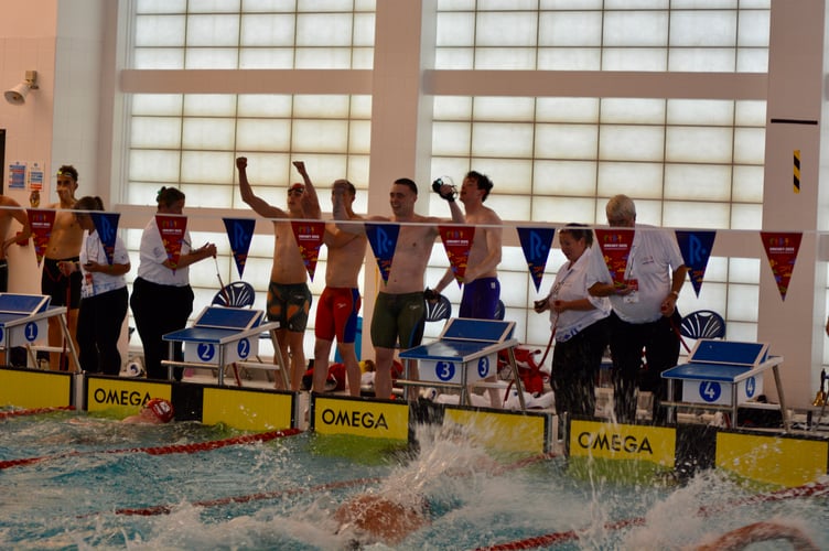 The Isle of Man's 4x50m relay team celebrate winning gold at a new Island Games record on Monday evening