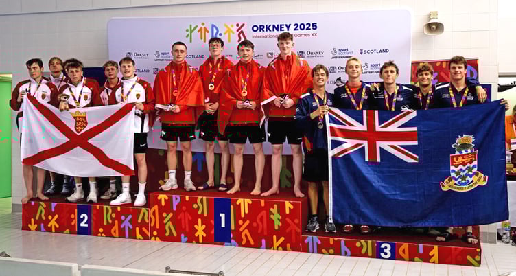 The Manx quartet of (left to right) Harry Robinson, Alex Turnbull, Joel Watterson and Magnus Kelly on the top step of the podium after smashing the Island Games record in the men's 4x50m medley relay (Photo: Euan Duff/Duff Company Productions)