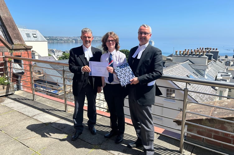Junior Tynwald Outstanding Participant award winner Conall Molloy from St Ninian’s High School with left, the President of Tynwald Laurence Skelly MLC and the Speaker of the House of Keys, Juan Watterson SHK