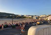 Pictures as thousands flock to beach festival with 'wall to wall sunshine'