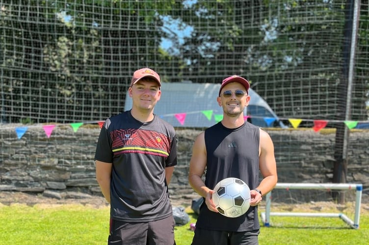 Marown footballers Niall Gibney and Jon Kenyon ran the busy coconut shy and football stall