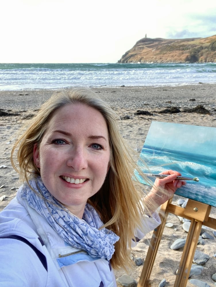 Clare Payne on Port Erin beach while painting
