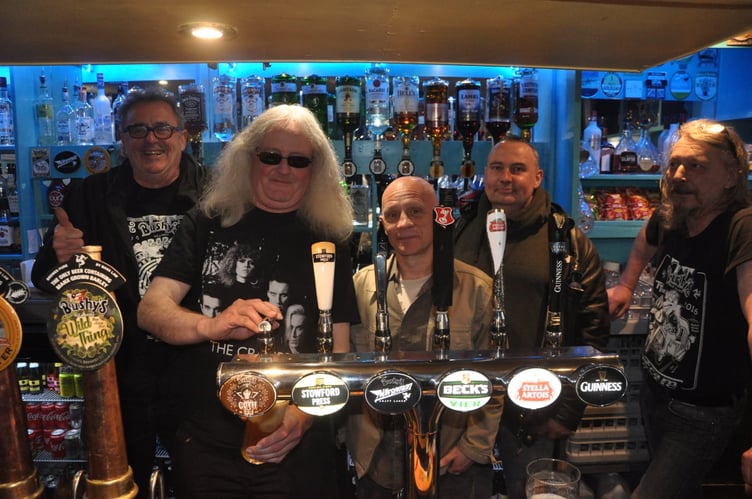 Raz McVeighty pouring a Bushy's Goth IPA in the Rover's Return