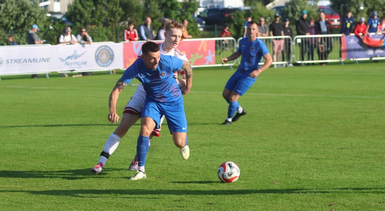 Lee Gale in action for the Isle of Man against Orkney on Tuesday when he earned his 50th cap and received a signed match ball from the players (Photo: Paul Hatton)