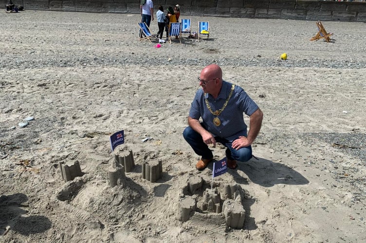Douglas Mayor Steve Crellin admiring the sand castles during Douglas Beach Day