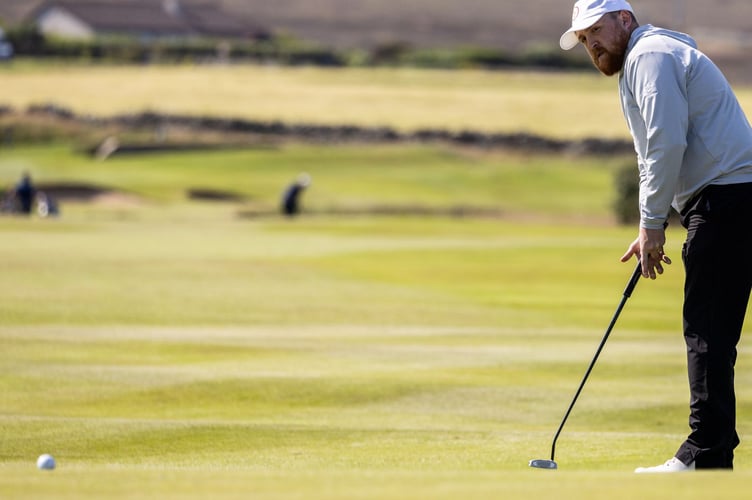 Robbie Noon sinks a putt on his way to claiming the silver medal in the men's golf competition at the Island Games. Noon enjoyed an impressive week at Orkney Golf Club and, having been team-mate Daryl Callister's nearest challenger in the race for individual gold, was key to the Isle of Man winning team gold (Photo: Gary Weightman)