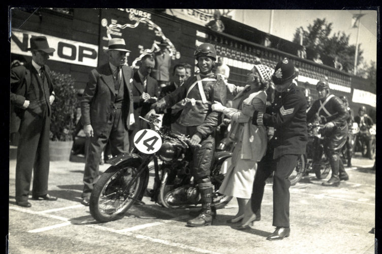 George Formby at the Isle of Man TT Grandstand, portraying George Shuttleworth
