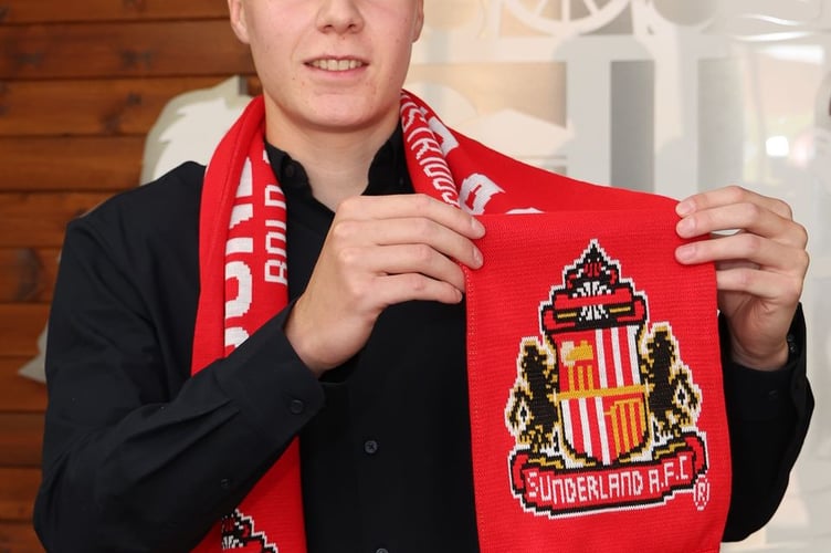 Isaac with his new club scarf