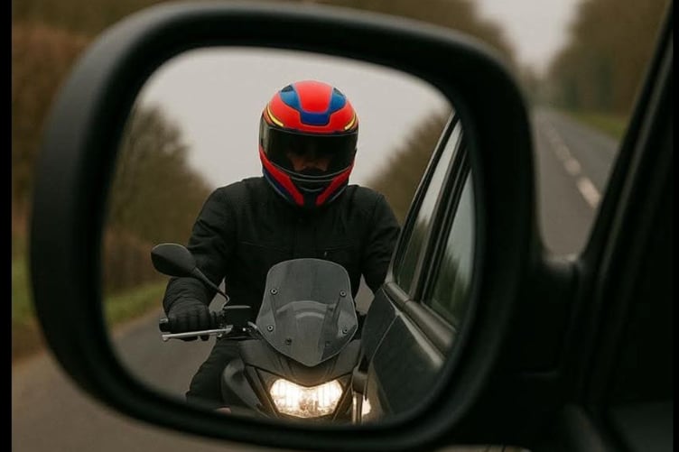 Motorcyclist in the wing mirror