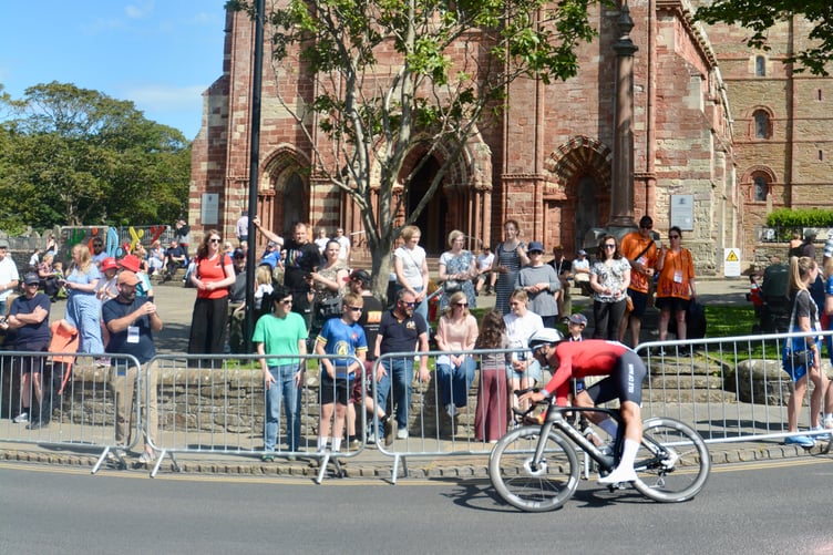 Isle of Man's Tyler Hannay passes St Magnus Cathedral during Friday afternoon's time trial (Photo: Andy Dalrymple)