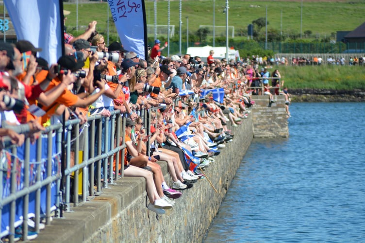 The walls of Stromness Harbour were lined with spectators for swim leg of the opening day's triathlon (Photo: Andy Dalrymple)