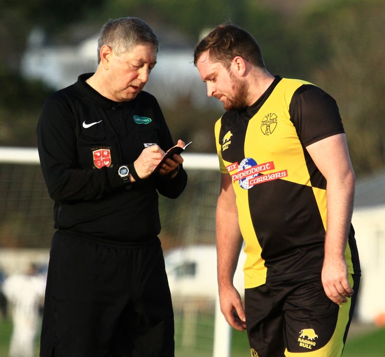 Footballers across the Isle of Man can expect several key rule changes ahead of the upcoming 2025/26 season. Pictured is referee Peter Greenhill and Johnny Myers of St George's AFC. (Photo - Dave Norton)
