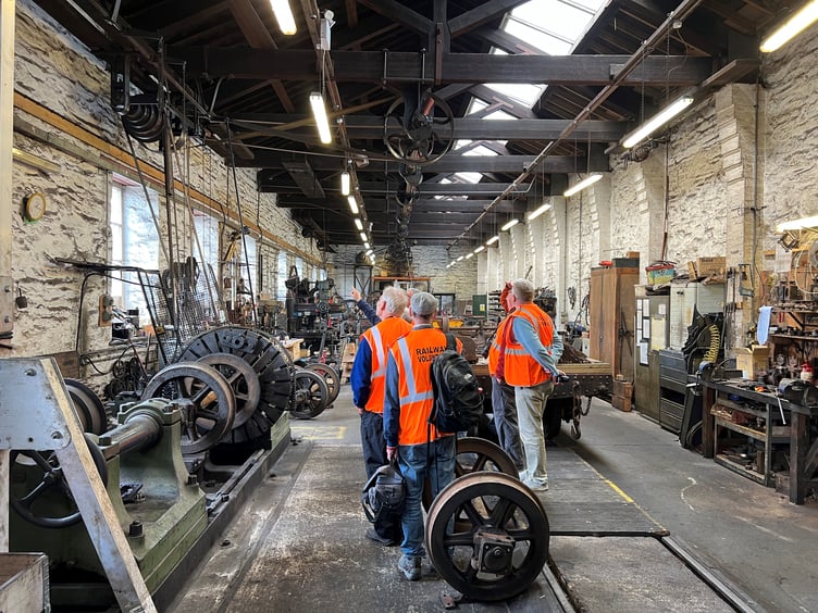 Enthusiasts are given a tour of the workshops at Douglas railway station