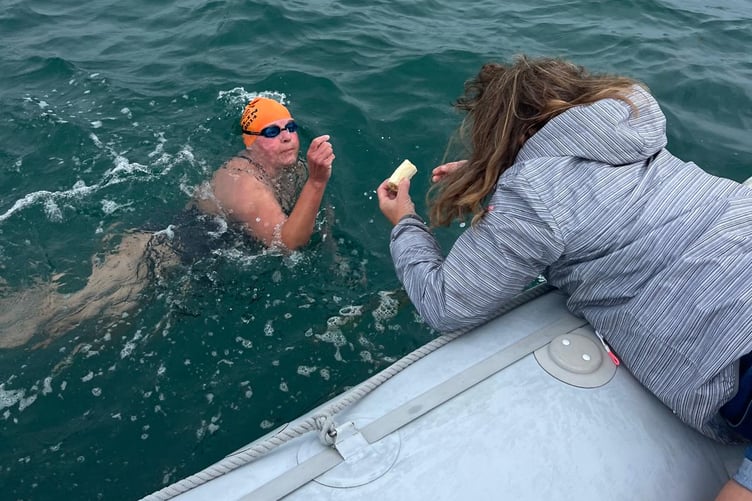 Judy Ewart throws a banana to Carole Laporte