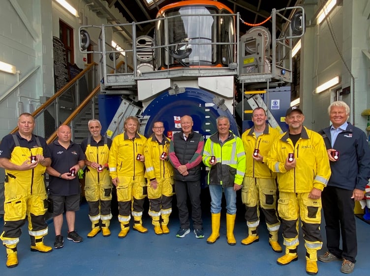 Lieutenant Governor Sir John Lorimer with nine of the ten Peel Lifeboat recipients of the King's Coronation Medals