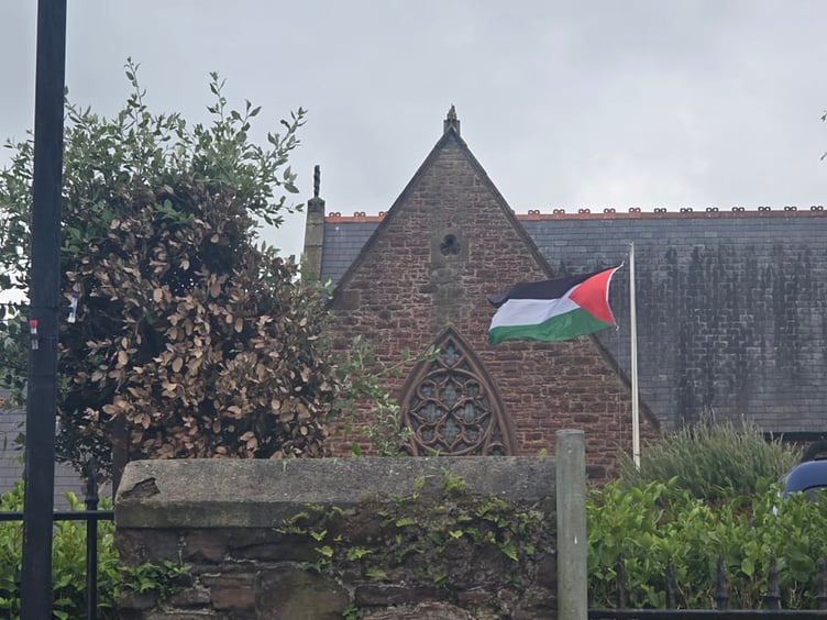 The Palestinian flag outside Peel Cathedral before it was stolen on Tuesday