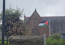 Cathedral dean says stolen Palestinian flag was replaced by Jewish woman