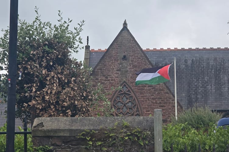 The Palestinian flag outside Peel Cathedral before it was stolen on Tuesday