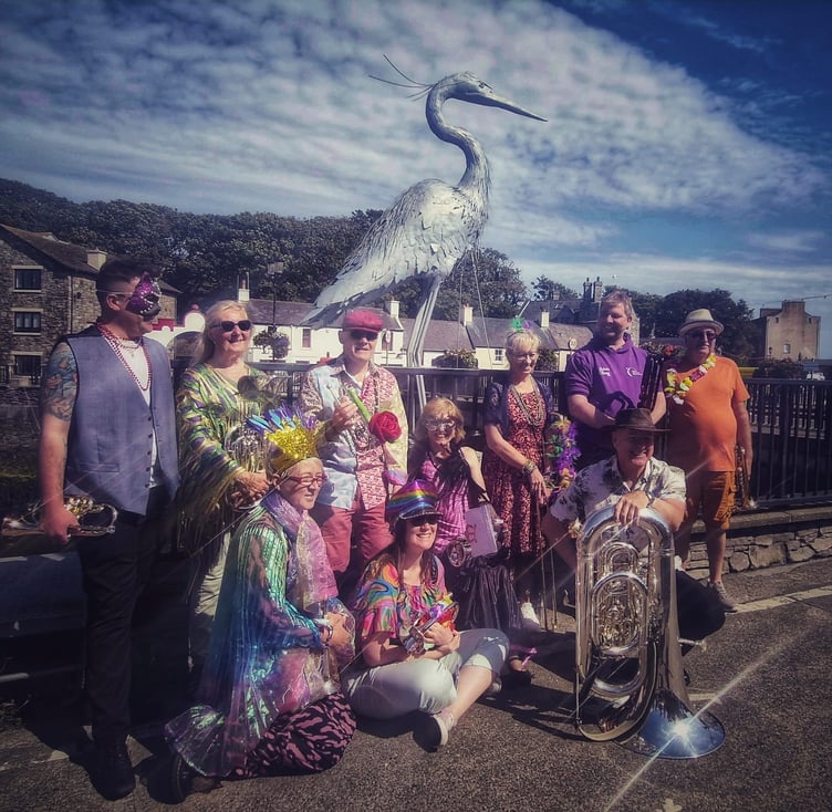 Participants in the fancy dress competition gather for a photo