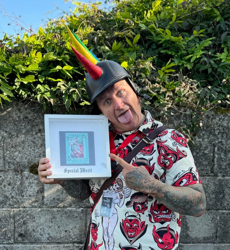 Simon Williams with his 'special merit' award from the Middleton Tattoo Convention near Cork, Ireland