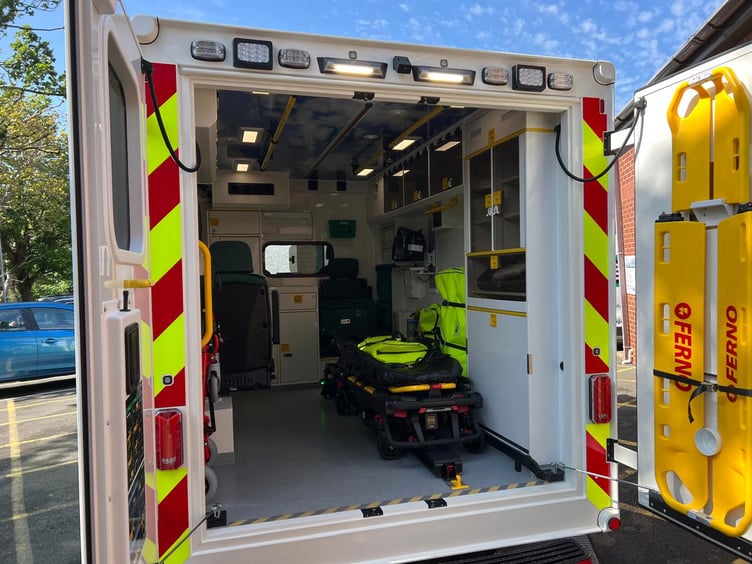 The stretcher machine at the back of the ambulance