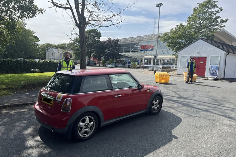 Tesco staff turn cars away at the store's entrance