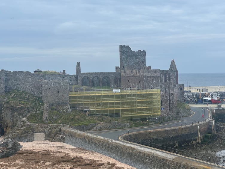Visitors to St Patrick’s Isle can currently see scaffolding wrapped in yellow mesh along the curtain wall of Peel Castle (Photo - Tom Curphey)